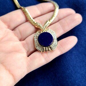 Vintage D'Orlan gold tone necklace pendant with dark blue/purple medallion.